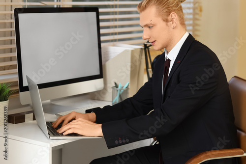 Young businessman working w...