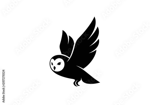 Black silhouette of a flying barn owl on white