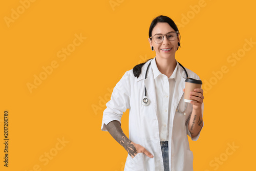 Tattooed female doctor with...