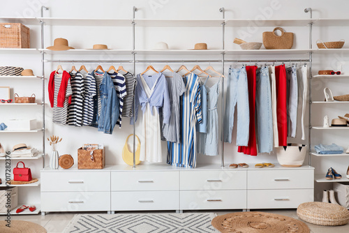 Clothes rack with shelves a...