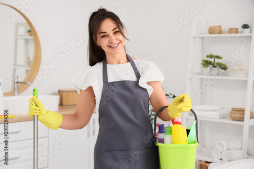 Female janitor with cleanin...