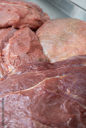 Close-up of fresh raw beef meat cuts and trimmings