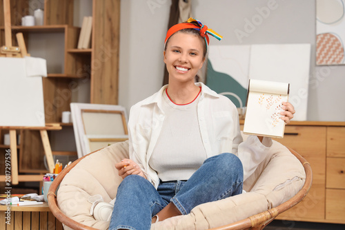Young female artist drawing...