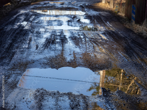 Bild auf Leinwand broken dirt road