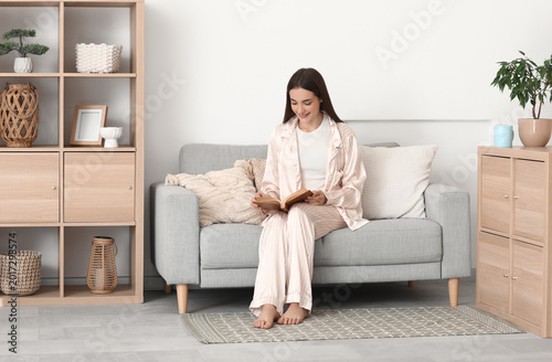 Young woman in silk pajamas...