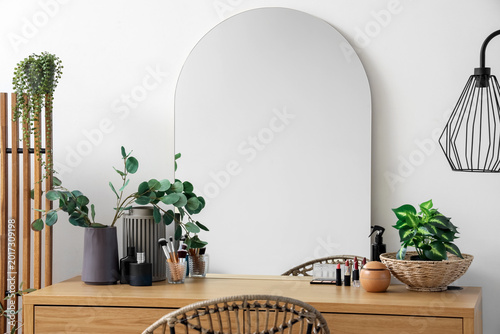 Schilderij op canvas Makeup products with plants and mirror on table in dressing room