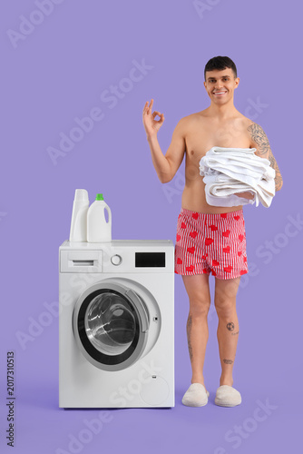 Young man in underpants wit...
