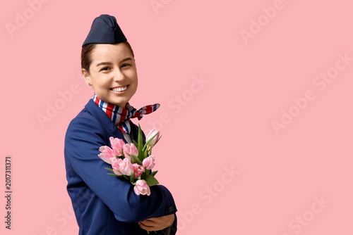 Young stewardess with tulip...