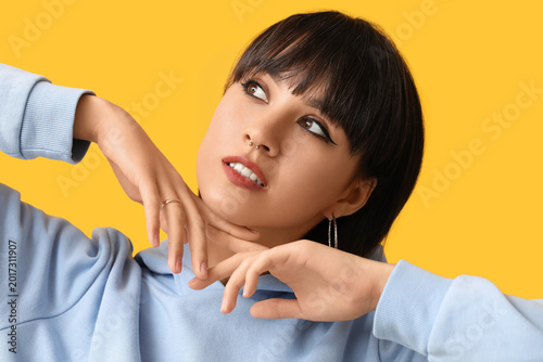 Stylish young woman with no...