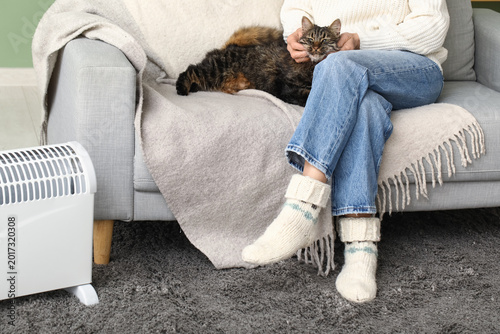 Woman with cute cat sitting...