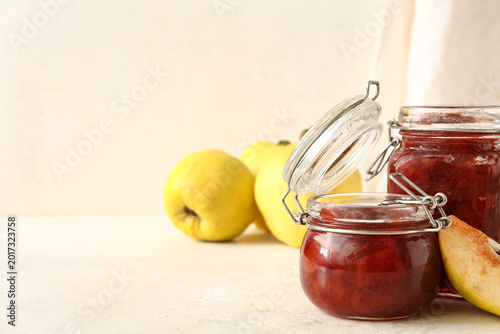 Jars of sweet jam with quin...