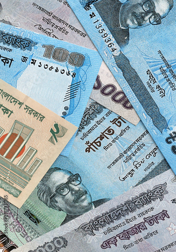 Fotografía Bangladeshi taka money banknotes pile on table
