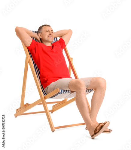 Mature man relaxing in deck...