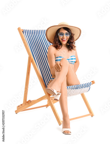 Young woman in deck chair o...