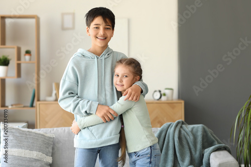 Little girl hugging her bro...