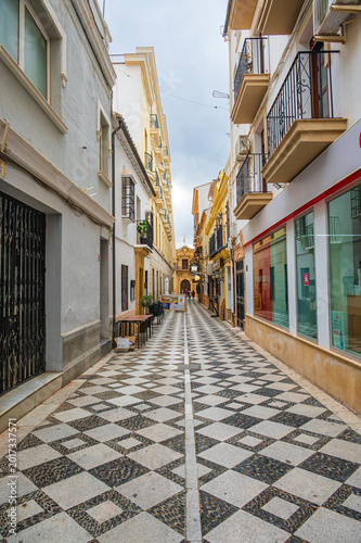Konstfotografi Narrow Pedestrian Street With Patterned Pavement Spain