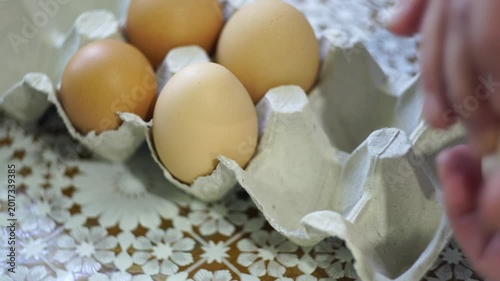 takes a few eggs from the package