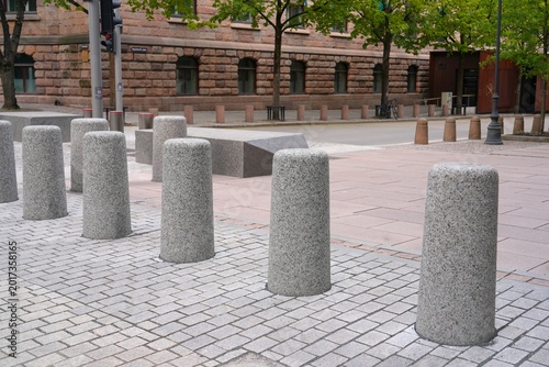 Canvas Print Bollards made of granite stone to prevent cars parking on pedestrian sidewalk
