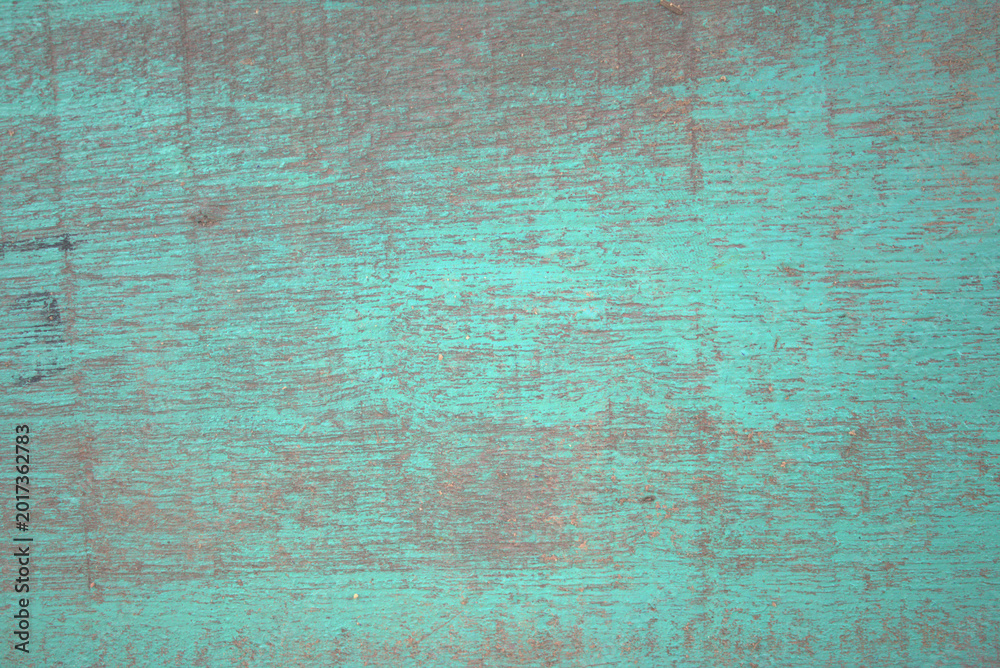 Fototapeta premium Green wooden planks with peeling paint and rough grain create a rustic, vintage textured background ideal for design, overlay, or editorial use emphasizing age, decay, and character.