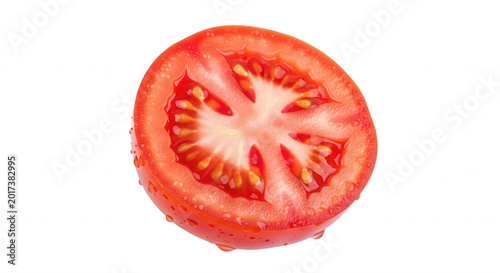 A single cross-section slice of a ripe red tomato with visible seeds and pulp, isolated against a solid black background