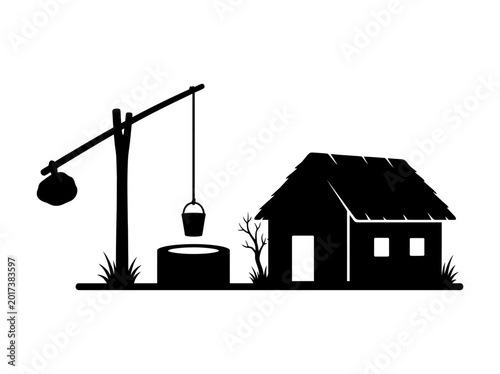 Farmhouse and well silhouette with bucket and lever black and white