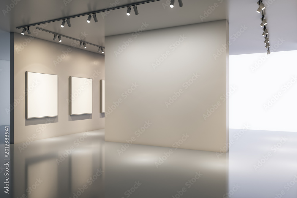 Naklejka premium Minimalist modern gallery interior with large blank wall, empty frames, soft lighting and open exhibition space for artwork display. 3D Rendering