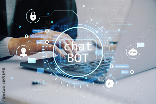 Hands typing on laptop with digital chatbot interface and futuristic tech ico...