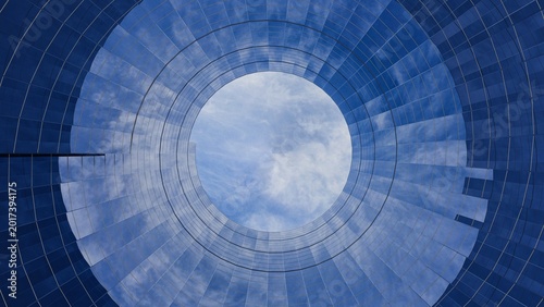 Photos 3D low angle view of a circular glass building facade reflecting a cloudy blue s