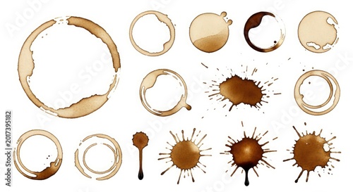Collection of coffee stain rings, splashes, and drips isolated on a white background. Set of brown liquid cup marks and grunge splatters for graphic design elements.