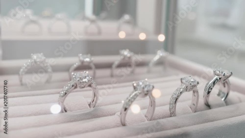 Elegant diamond engagement rings displayed in a jewelry store with sparkling gemstones and silver bands