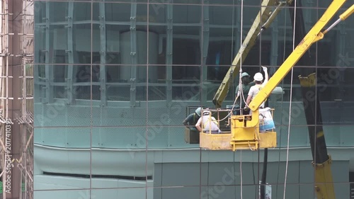 Teamwork in Action: Repairing a Glass Wall in Hong Kong
