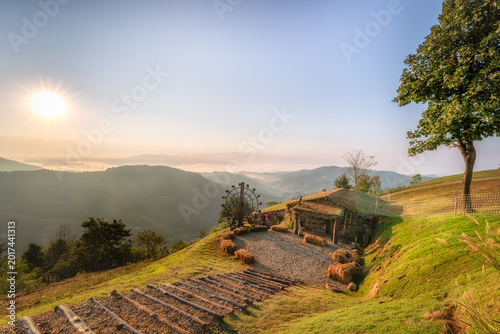 Vászonkép Scenic Sunrise Over Mountain Landscape with Rustic Cabin in Chiangrai