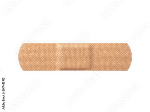 One single tan adhesive bandage strip for medical first aid and wound care