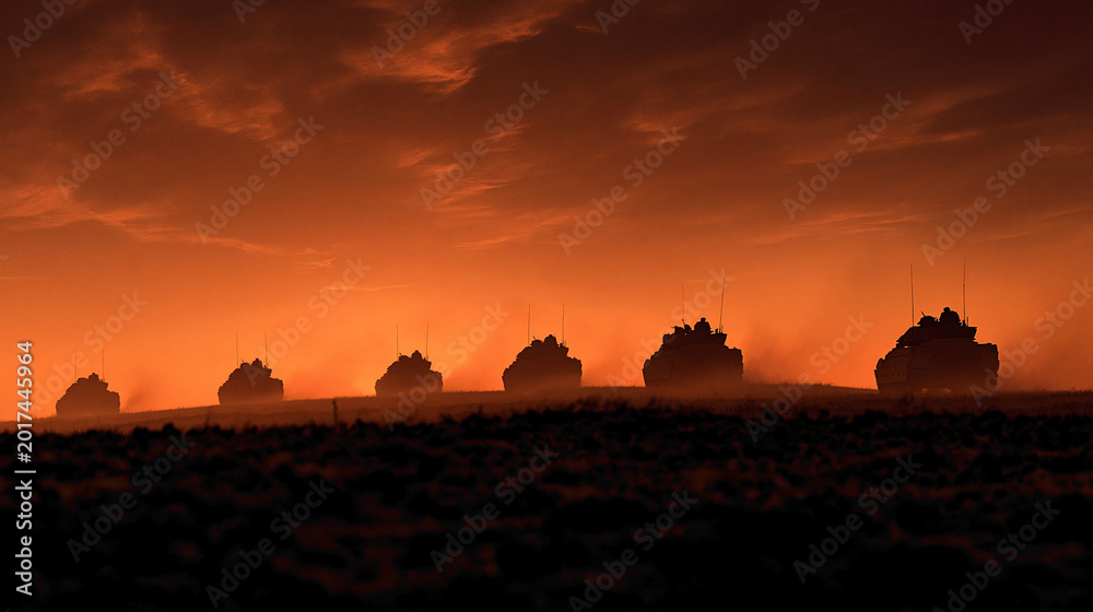 Obraz premium Military tanks advancing at dusk desert landscape high-contrast image dramatic atmosphere