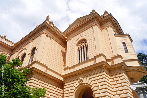 Canvastavla Palace of the Patriarchate facade in Sremski Karlovci rising above greenery