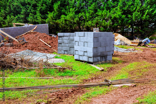 Foto Construction site with building materials cinder blocks gravel path