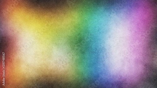 Rainbow gradient diffuse light during Pride Month against a dark textured background with copy space