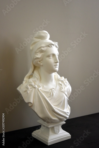 closeup of stoned statue of mariane the famous symbol of the french republic