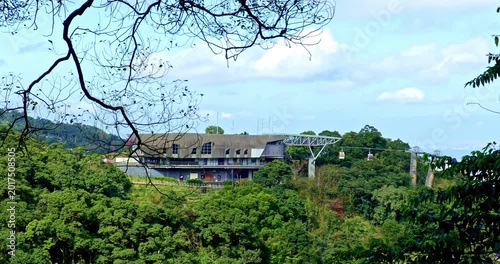 Panoramic views from the Taipei Maokong Gondola station nestled amidst lush green mountains and forests.