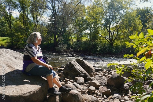 senior woman enjoying the Kabir Kouba river in Wendake, canada