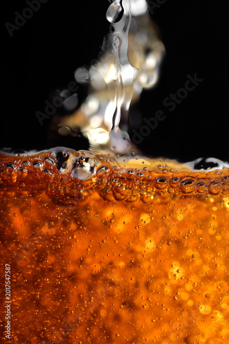 High resolution photo of a richly textured liquid cognac or whisky