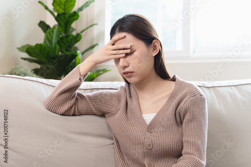Photos Depression in teenage concept, Young women covering her face feeling anxious and unhappy lock themselves at home sad emotional alone, and have mental disorders