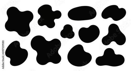Foto Abstract black ink blot shapes set on white background.