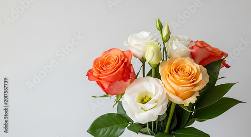 Mixed bouquet of colorful roses and lisianthus on white background  