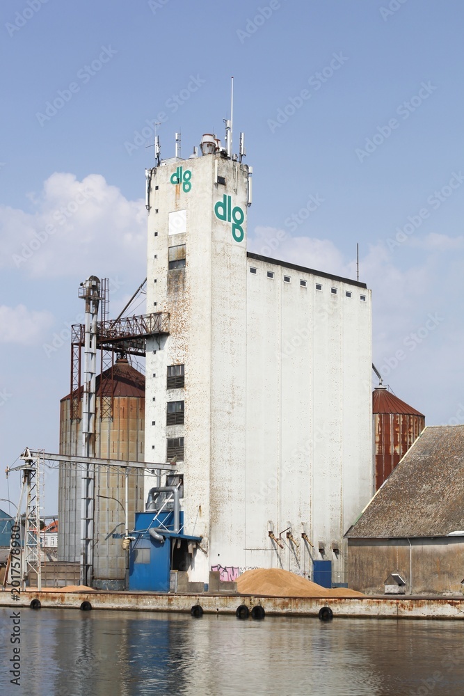 Obraz premium Assens, Denmark - August 14, 2025: View of the industrial harbor of Assens in Denmark