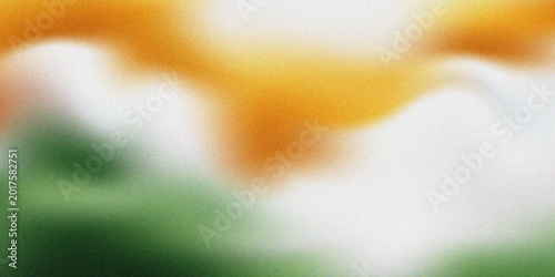 Foto Abstract blurred background featuring a soft gradient blend of saffron orange, white, and deep green, evoking a patriotic or organic textured atmosphere