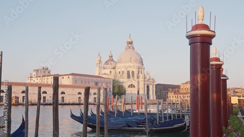 Gondolas on Venice canal with Basilica Santa Maria della Salute in background