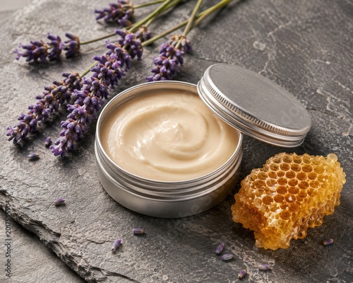 Natural organic cream with lavender and honeycomb on a dark stone background