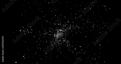 Dynamic water splash explosion isolated on black background with realistic liquid droplets for VFX overlay and cinematic visual effects