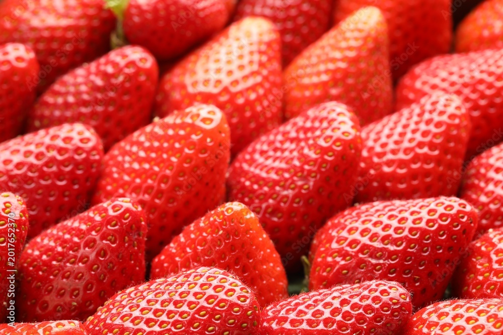 Obraz premium Many fresh ripe strawberries as background, closeup